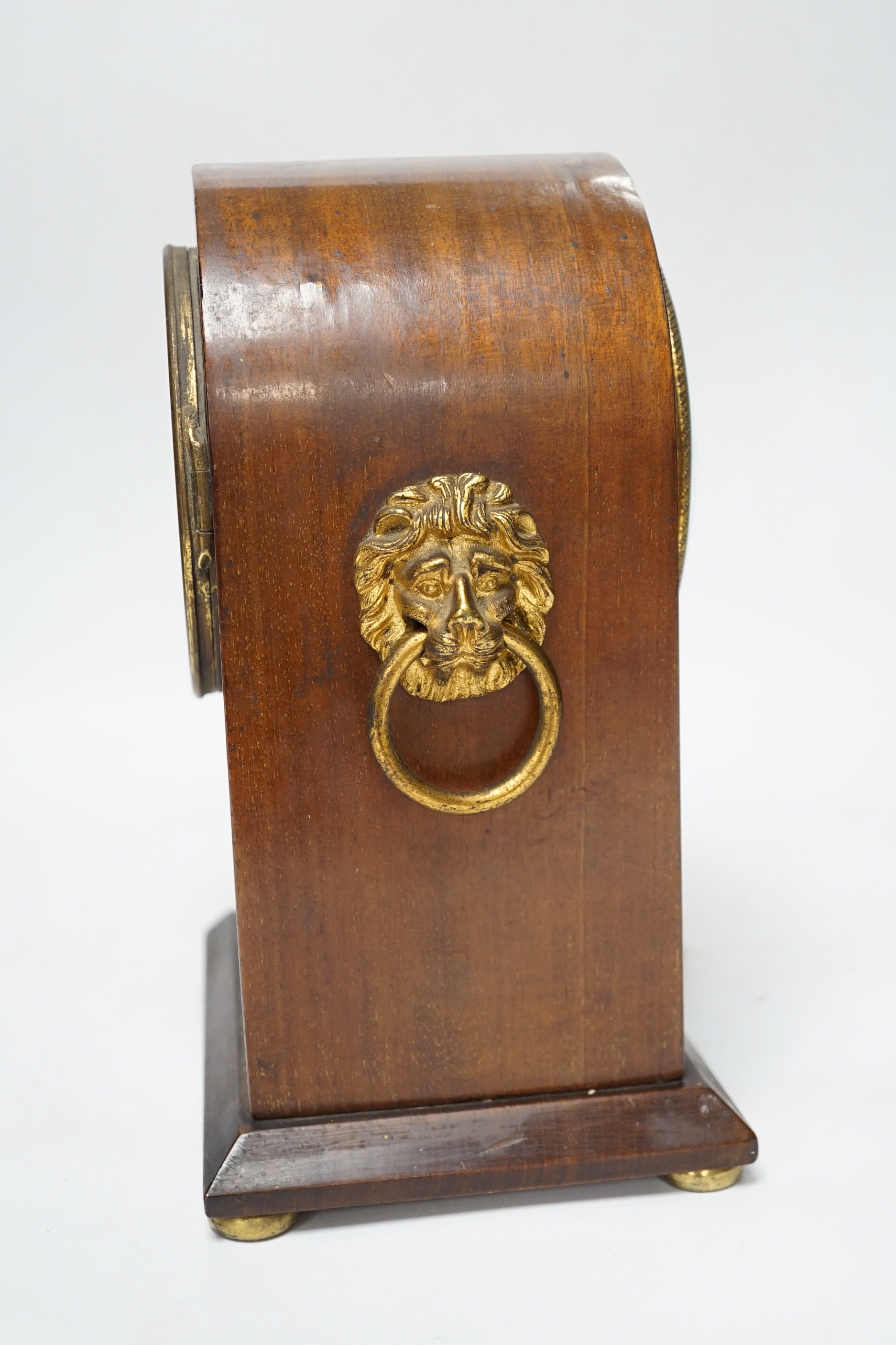 An Edwardian mahogany mantel clock, French movement striking on a coiled gong, 25cm high